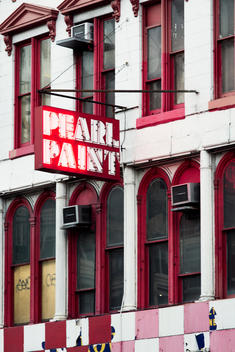 Facade of abandoned store with neon sign in Manhattan