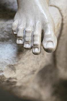 Foot detail of life-size marble statue known as the Barberini Faun or Drunken Satyr
