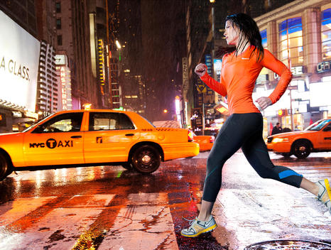 Woman Running In The Rain In Times Square New York