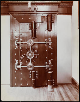 A Safe Deposit Vault With Door Closed.