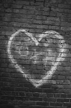 Drawing of heart on brick wall