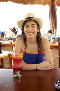 Girl on vacation with tropical drink