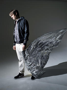 Fashion Story With A Male Model, Incorporating Lots Of Movement Silver Foil Around Leg