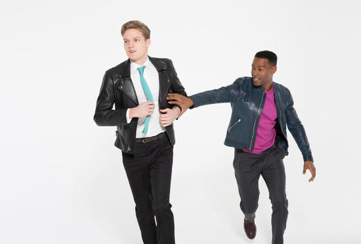 two guys messing around in studio leather jackets