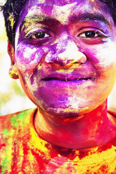 India, Ahmedabad, Young man celebrates Holi festival