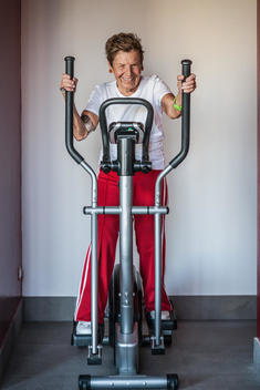 Portrait of a very senior woman using an exercise machine