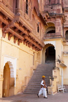 Indian man in traditional clothes inside Mehrangarh Fort