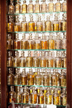 Perfumes stacked on shelves at a shop in the medina of Marrakech, Morocco