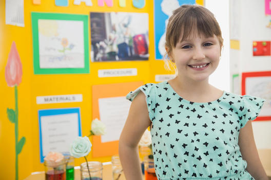 Portrait of confident school girl at science fair