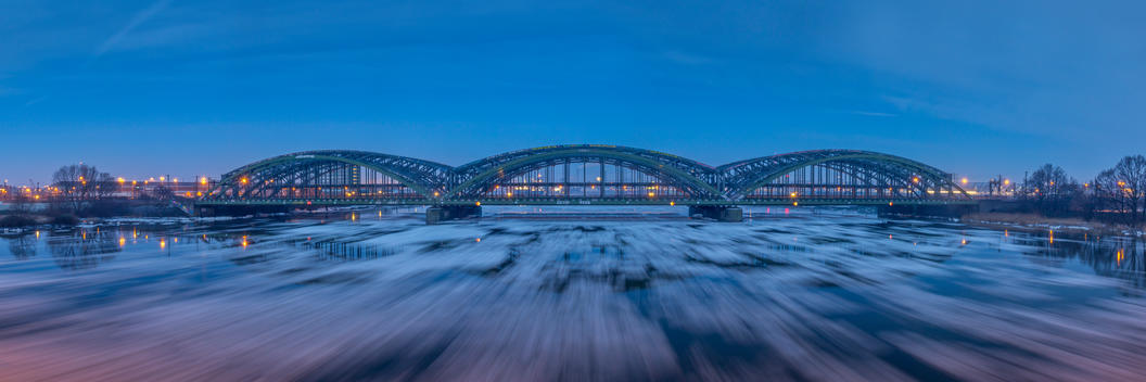 Germany, Hamburg, Elbe bridge with ice drift on the river during sunrise