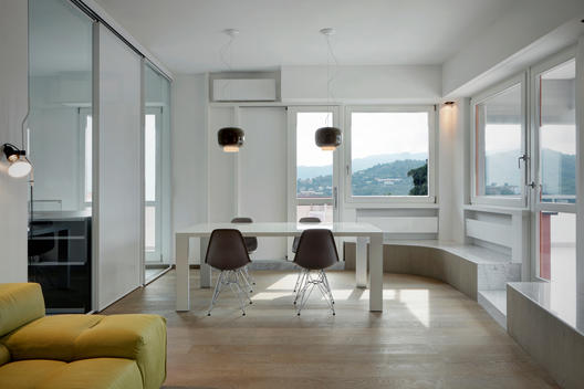 Open plan dining room with uncurtained windows in Casa YM, Rapallo, Liguria, Italy
