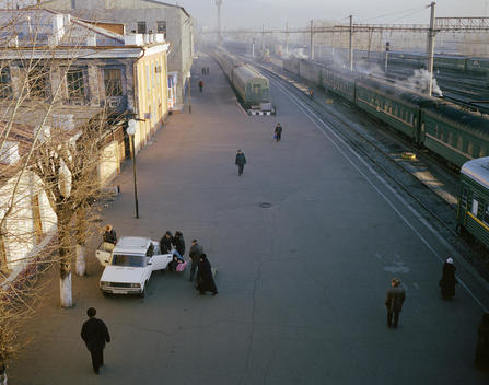 An Elderly Passenger Is Carried Off The Trans-Siberian Train On A Stretcher At The Station In Chita.