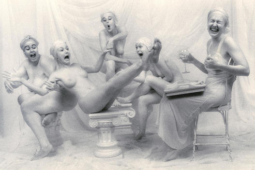 Five nude women laughing with one woman holding wine and a tray of food on her lap and another woman falling off her stool