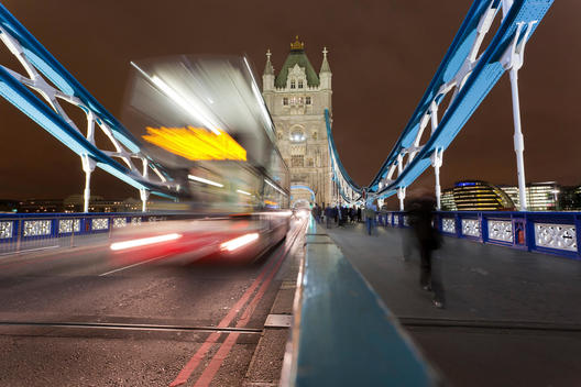Great Britain, England, London, View of Double-Decker Bus, blurred on tower bridge at night