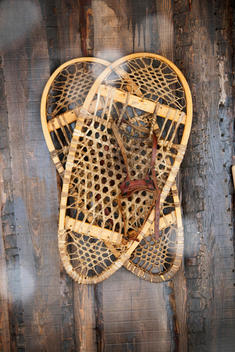 Old wooden snow shoes hang on the wall, now as decoration, at an Ice Hotel in Kirkenes in the Finnmark region, northern Norway