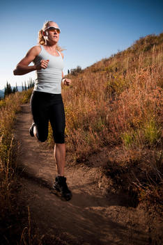 Woman Running On Dirt Path
