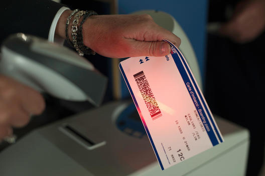 Person holding tickets at airport check in area