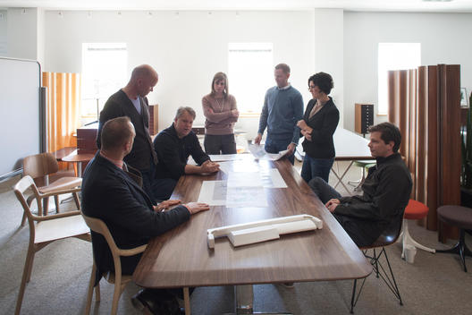 Herman Miller design team members working together around a office table