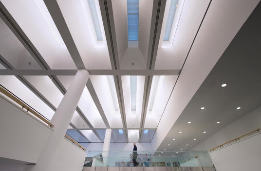 A man walks inside the white modern architecture - (Internal Mart Museum)