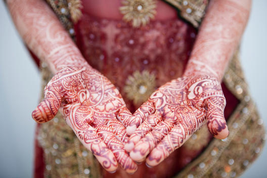 Caucasian woman with Indian henna tattoos on her hands