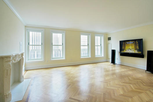 Empty Room With Parquet Floors And Marble Fireplace, And Media Center