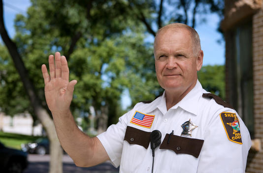 The Rice County Sheriff Poses For A Portrait In Front Of The Police Station In Faribault, Mn.