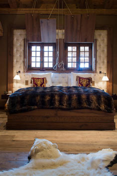 bedroom in luxury ski chalet with polar bear skin run