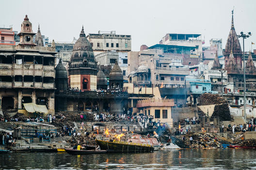 View of Manikarnika Ghat, a burning ghat on the banks of the Ganges River in Varanasi, India.