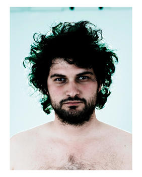 Portrait Of 25 - 30 Year Old Bare-Chested Man Of Caucasian Appearance