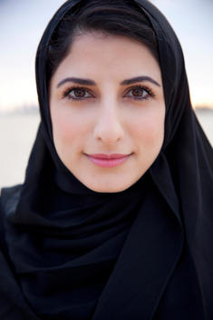 Portrait of an Arabic woman in an abaya.