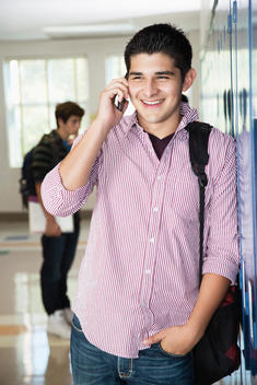 Hispanic high school student talking on cell phone