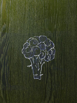 A line drawing image on a natural wood grain background. A head of broccoli, florets and stem.