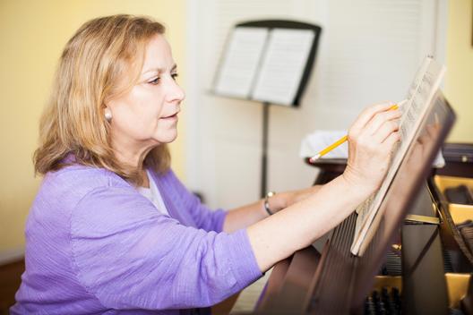 Senior woman checking notes
