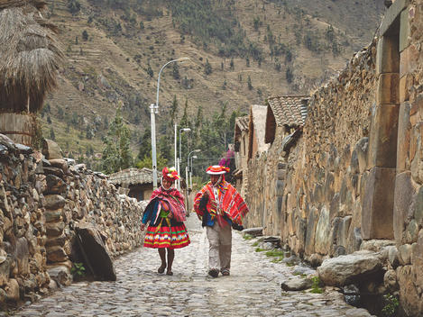 Native local Peruvians dressed in traditional garb