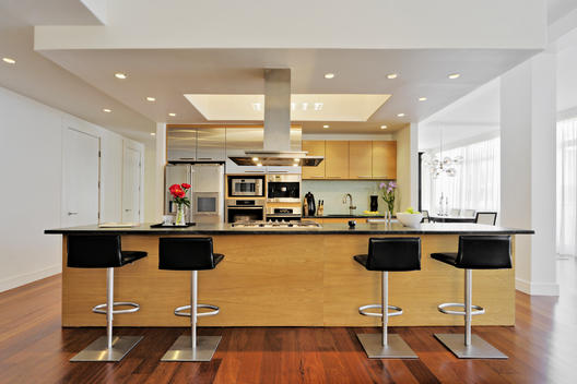 Modern Kitchen With Recessed Ceiling, Leather Backed Stainless Stools, Super Clean Fixtures, Dining Room Visible In Background