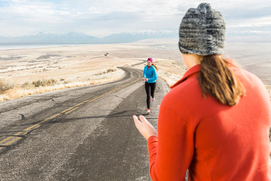 Young woman encouraging her sister to finish her run - Antelope Island State Park