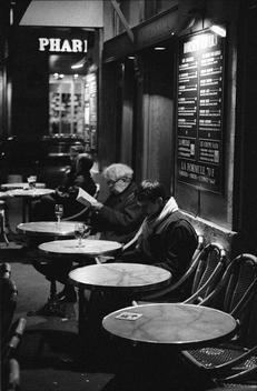Black and white photograph of tables in Paris