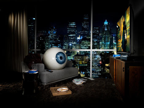 giant eyeball in apartment room, advertisement for blu-ray technology