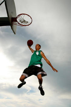 Underview Of Man Dunking Basketball