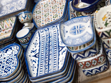 Artisanal handmade dishes and cups for sale at a shop in the medina in Fes, Morocco