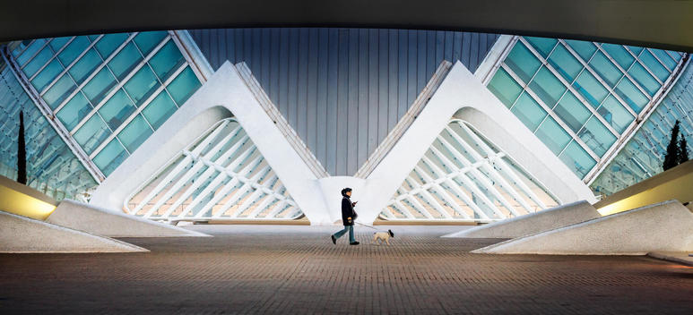 girl with a dog in front of a modern architecture ( City of Arts and Sciences)