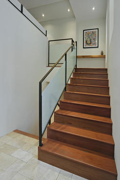 View Up Wood Stairs, Frosted Glass And Iron Railing, Keys Shelf