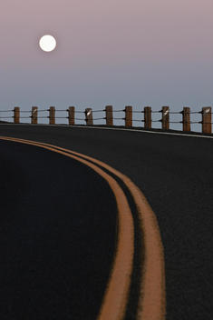 Full Moon Over a Curving Road