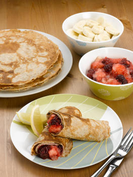 Homemade pancakes filled with stewed fruit