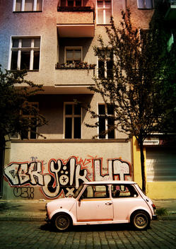 Mini car parked on street in Berlin.