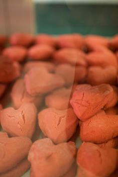 A Tray Of Freshly Baked Red Heart Shaped Cookies On Display For Valentine’S Day