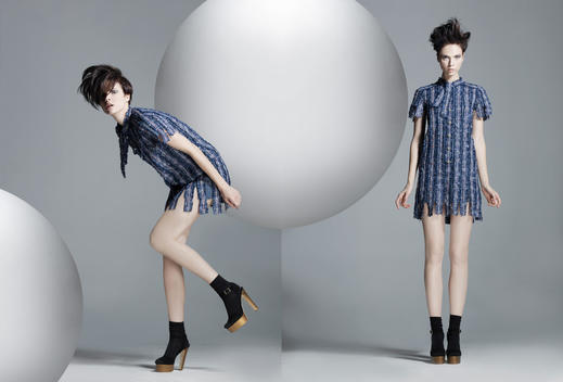 Fashion Story Based On A Theme With Spheres Of Various Sizes In A Studio Surrounding, Model In The Same Image Twice With A Sphere In The Middle.