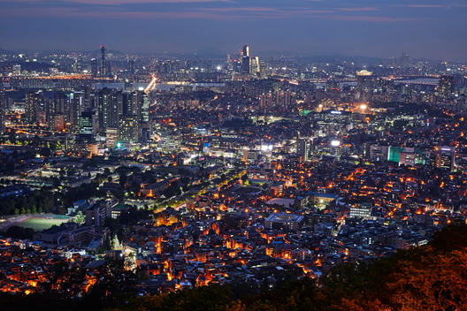 Elevated view of the South of the centre of Seoul with business district of Seocho-Gu and Gangnam-Gu illuminated at night from North Seoul Tower