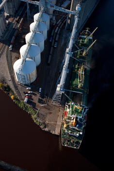 Aerial View Of A \'Salty\', An Ocean Going Grain Ship, Loading Grain At The Cenex Harvest States (Chs) Grain Elevator In Port Of Duluth-Superior, Superior, Wisconsin