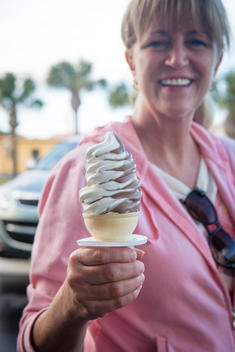 Woman holding soft-serve ice cream in Cocoa Beach, Florida, USA